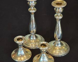 Weighted sterling candlesticks.