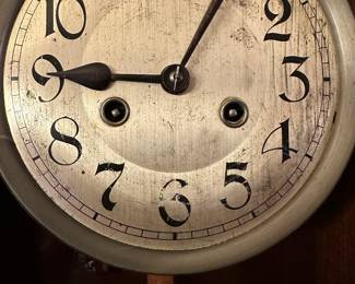 #8 - $150 - Continental Art deco wall clock with key 30tx12wx6d as is