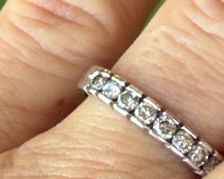 #100- $150 - 14kt white gold band with round 10 diamonds. size 6 3/4- 2.10 grams.