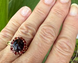 #96 - $250 - 10kt yellow gold cabochont black star sapphire & bezel garnet. Size 6 - 3.63grams.