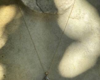 #92 - $220 - 10kt yellow gold pendant peridot stones with chain