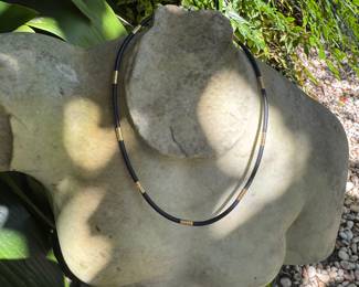 #94 - $70 - 14kt black leather necklace with gold accent 