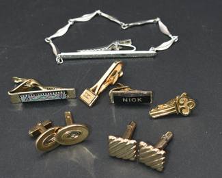 lot of cufflinks and tie tacks