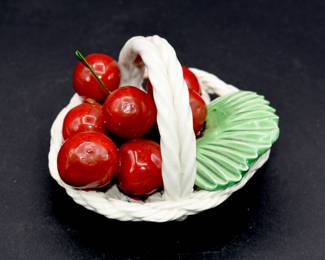 ceramic cherries in a basket