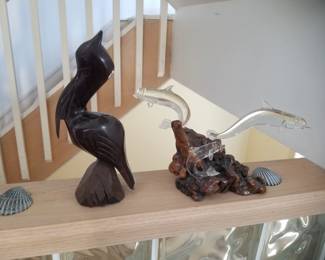 Shore bird sculpture; dolphin sculpture