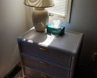 3-drawer nightstand; table lamp