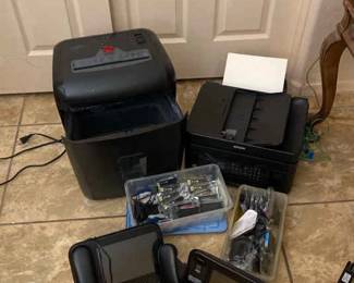 Two Closed Captioning Phones, A Printer, And A Paper Shredder