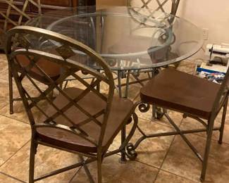 Round Metal And Glass Outdoor Patio Table And Four Matching Chairs