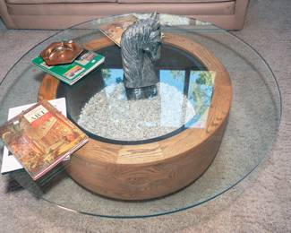 Pretty amazing coffee table, glass top is 1" by 48"