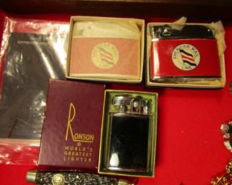 Several vintage lighters with advertising