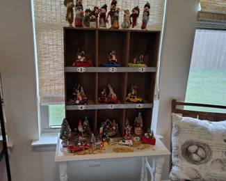 Vintage table with hand stenciled floral design, old cars and salt shakers made into Christmas decor.