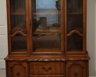 Vintage china cabinet with glass doors.