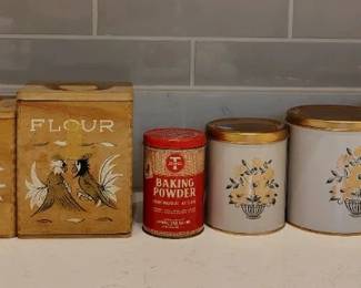 Two sets of vintage canisters, vintage baking powder tin.