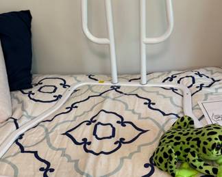 Safety bed rail to slip between the mattresses