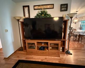 70" Hisence smart television; Oak entertainment center