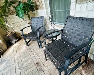 Little patio set each chair has a foot stool and there is a little table