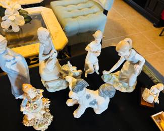 What would a sale be without figurines? Girl is checking to see if dog is friendly.  