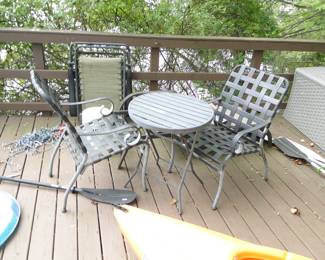 Two black chairs with small table