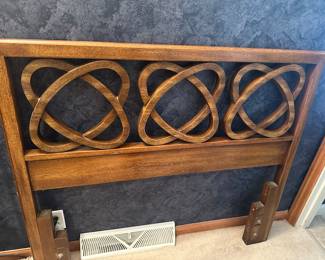 Adorable twin headboard that matches desk and chest in room.