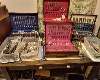 Silverware sets and individual pieces. Some silver, some silver plated