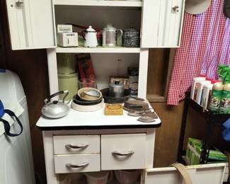 Metal cabinet, Tupperware containers, berry bucket, tea pots, old irons