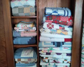 Antique wardrobe and quilts