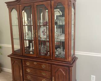 Two piece lighted hutch. Cherry Wood made by American Drew