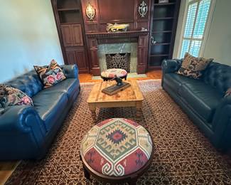 Two woven fabric Ottomans on either side of pine coffee table. These are quite fabulous.