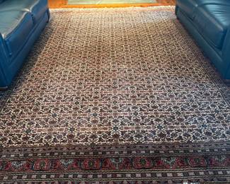 Another beautiful old rug in the main living room. Has integrated fringe and is wool. The rug is 9x12