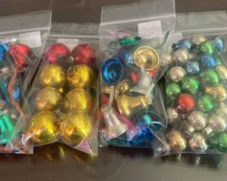 Bags of small mercury glass ornaments and bells with ornaments inside