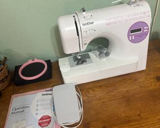 Brother sewing machine in nicer than average cabinet
