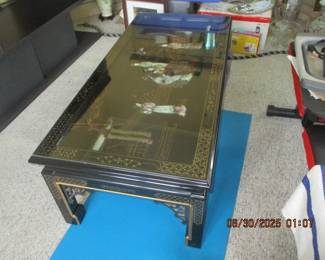 black lacquer Asian coffee table with Mother of pearl carvings