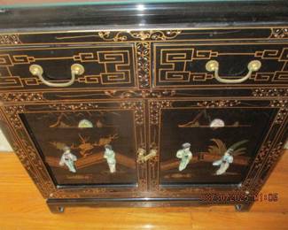 Smaller black lacquer Asian Cabinet with Mother of pearl carvings