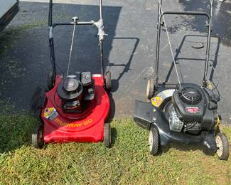 two working push lawn mowers