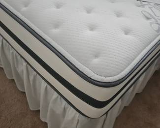 We took the sheets off so you can see the corner of the plushness of the mattress