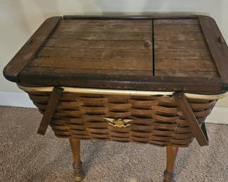 The clients must be from the north. Floor sewing basket with handles.