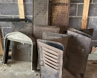Ford Model T spare parts; hood panels, radiator surrounds, running boards)