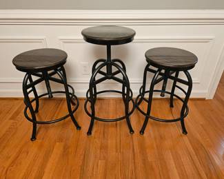 Set of 3 industrial style swivel/adjustable stools with wrought iron bottom and wooden seat