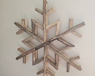 One of three driftwood snowflake wall hangings