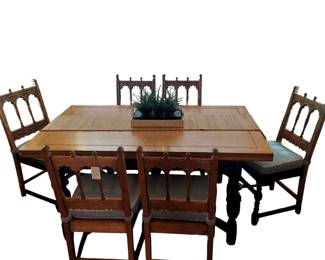 Solid Oak Jacobian Draw leaf table. (Leaves pull out from each end) Six matching chairs. Chairs have custom seat cushions.