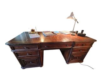 Haverty executive desk showing backside. 3 drawers each side and center drawer.