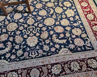 8 x 11 Fringed wool Oriental area rug (Navy and reds) (No brand name showing)