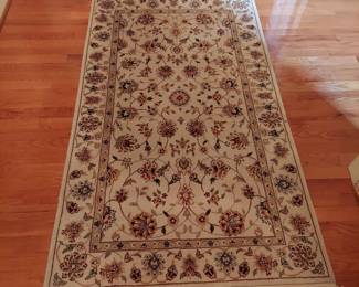 3 x 4 Fringed wool area rug in cream and rust