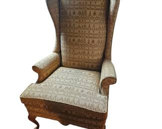 One of a pair of Conover gold upholstered wingback chairs