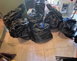 5 large bags of yarn suitable for projects.