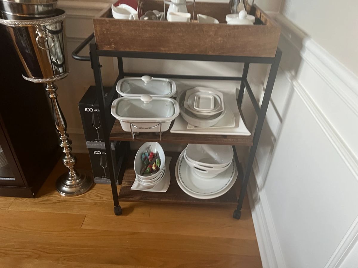 Various serving dishes and cart