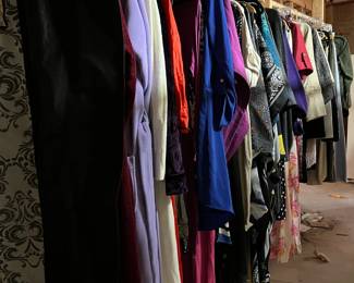 Racks of womens clothes, including designer brands and 2 wedding dresses