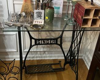 Antique Singer cast iron base with glass top. 