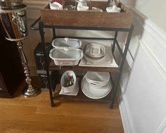 Various serving dishes and cart