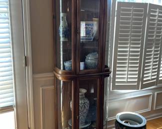 Curio cabinet with lights on top and bottom, Blue china vases and serving dishes